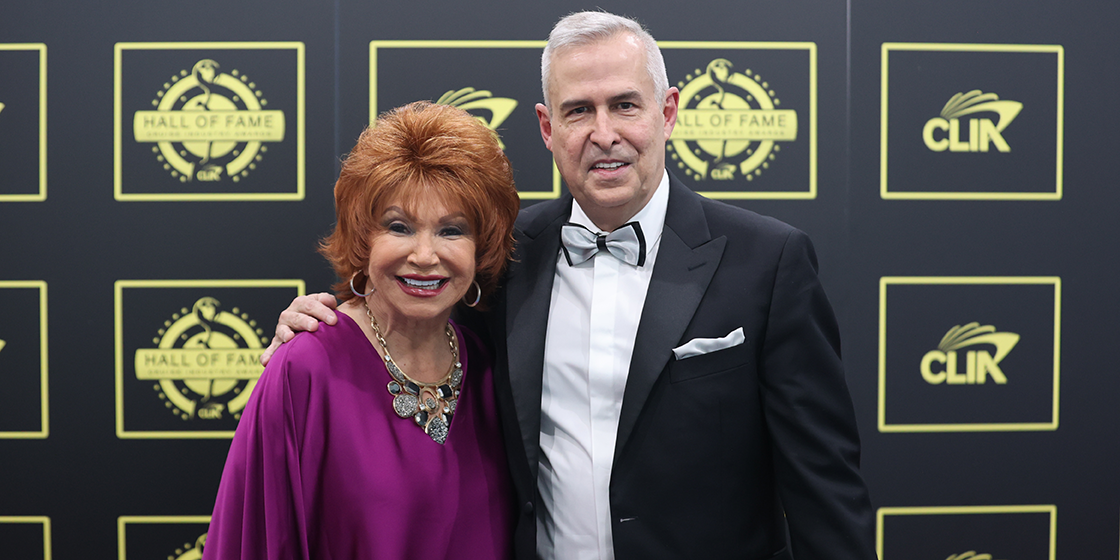 2 people posing at the Hall of Fame awards