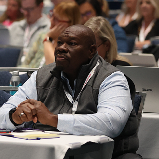 Man attending a learning seminar