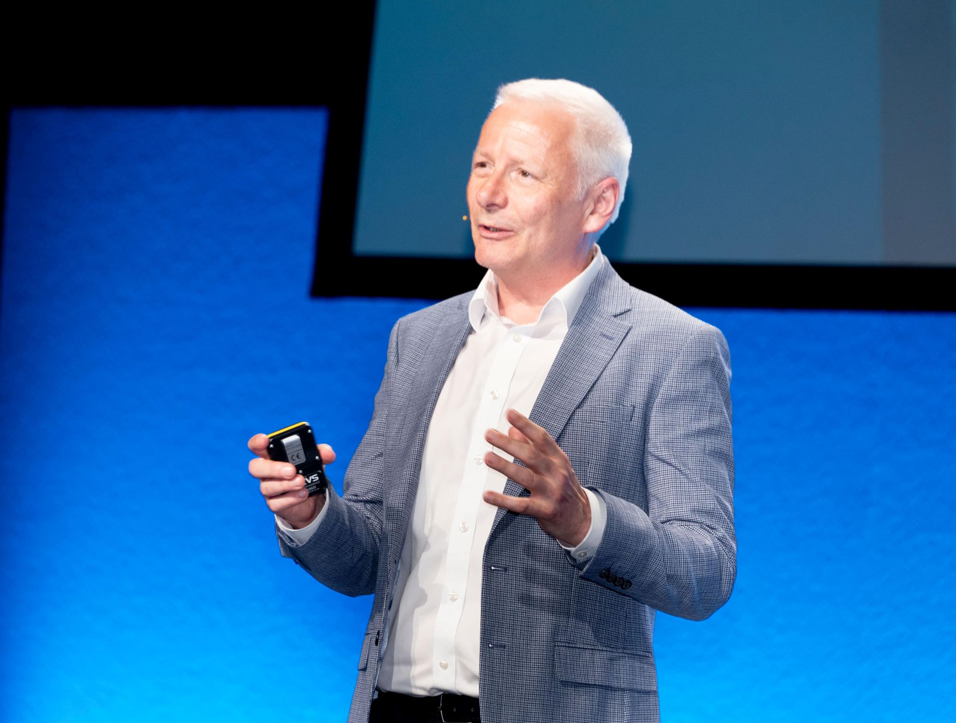 Andy Harmer speaking on stage