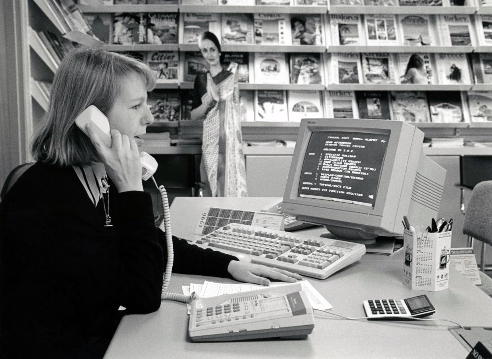 travel agent on the phone in the 1990's