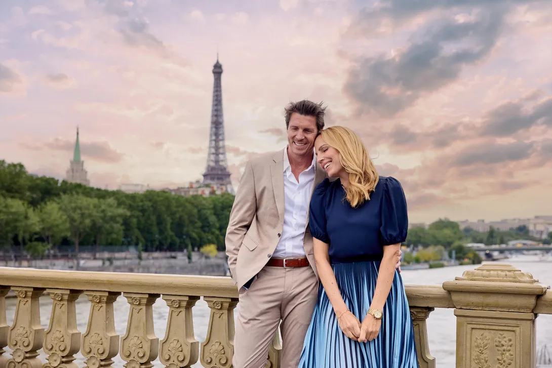 A couple in Paris with the Eiffel Tower in the background